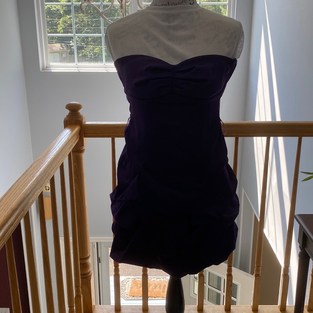 Strapless purple cocktail dress.